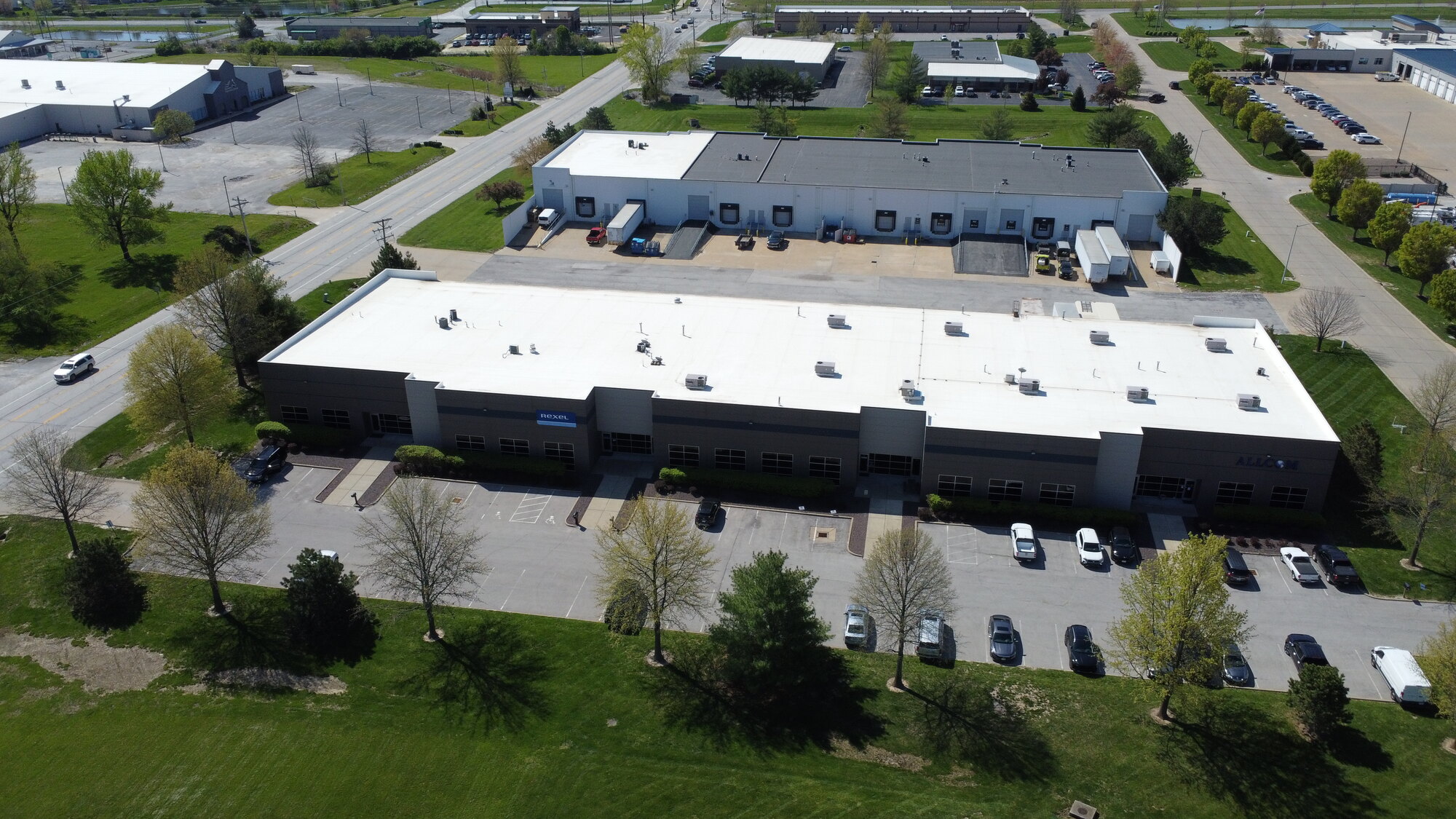 Wide front view of 201–215 Stag Industrial Blvd showing full parking and building footprint