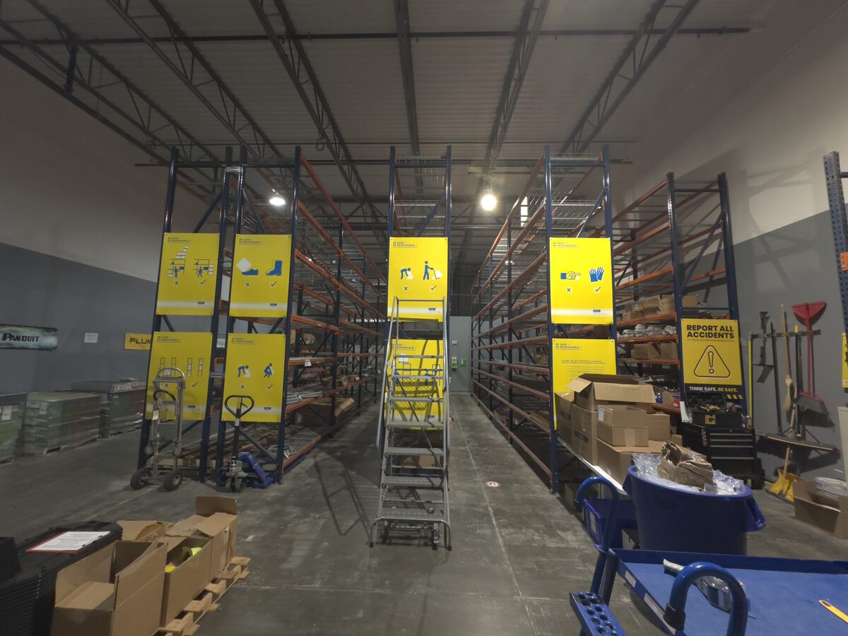Rexel USA warehouse pallet racking with safety signage